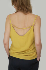 Close up portrait of Caucasian woman in yellow linen camisole shirt