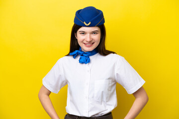 Airplane stewardess Russian woman isolated on yellow background laughing