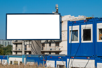 Blank white advertising billboard on the construction site area