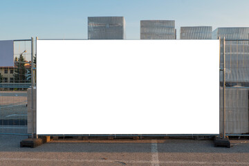 Blank white banner for advertisement on the fence of construction site