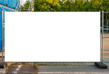 Blank white banner for advertisement on the fence of construction site