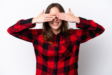 Young caucasian woman isolated on white background covering eyes by hands and smiling