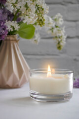 aroma candle flower lilac in the apartment