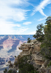 Fototapeta na wymiar Grand Canyon, Arizona AZ, landscape of craters, rocks, minerals, boulders, sky, contrast in nature, environment shot, desert plants