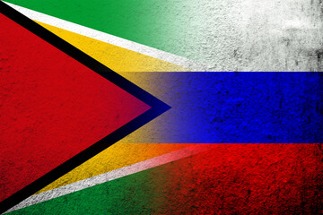National flag of Russian Federation with The Co-operative Republic of Guyana National flag . Grunge background