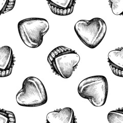 Seamless pattern with black and white chocolate candies