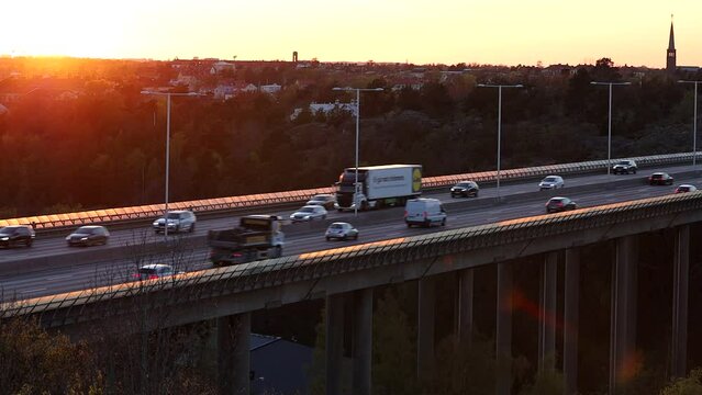 Stockholm, Sweden Traffic on the E4 highway or Essingeleden at sunset.