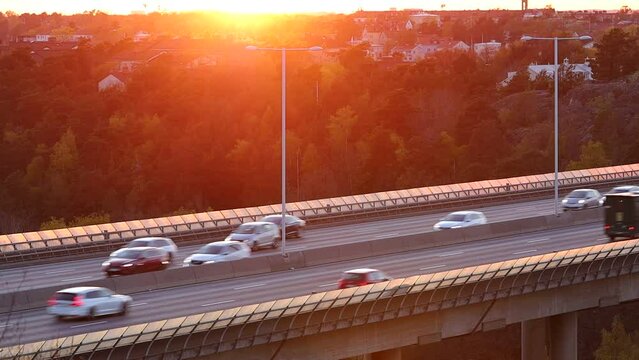Stockholm, Sweden Traffic on the E4 highway or Essingeleden at sunset.