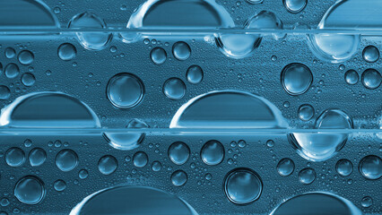 Water drops closeup. Abstract aqua wallpaper. Blue tinted natural background. Strong macro
