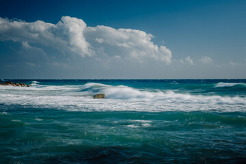 stormy sea and waves in sunshine