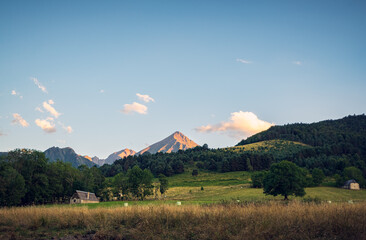Authentic Pyrenean barns with slate roof and exposed stone in the Aure valley. amazing view on the...