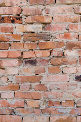 Red brick wall, close-up, brickwork background. Old building materials