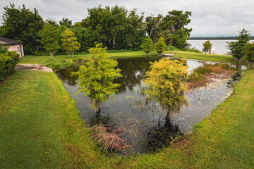 A retention pond close to a large lake for rainfall runoff