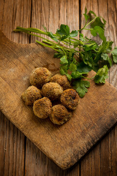 vegetarian meatballs with parsley over cutting board