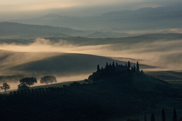Tuscany Italy sunrise on foggy morning