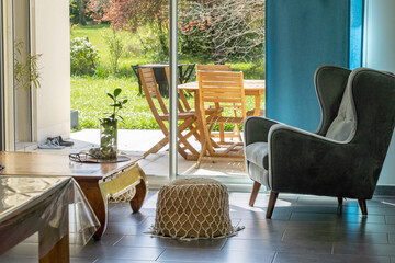 View from the living room onto the terrace, through the bay window, on a beautiful sunny spring day