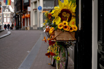 Bicycle decorated with flowers parked in the street