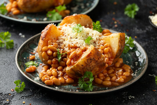 Jacket Baked potato with tomato beans, cheddar cheese. Traditional British food