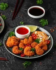 Crispy Prawns in breadcrumbs. Served with cabbage, carrot salad and soy and sweet chilli sauce