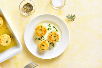 Fondant potatoes on plate