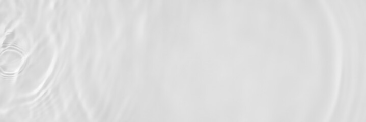 Obraz premium Water texture with sun reflections on the water overlay effect for photo or mockup. Organic light gray drop shadow caustic effect with wave refraction of light. Long banner with copy space.