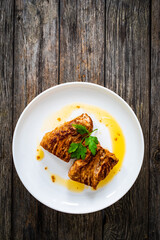 Roasted pork loin on wooden table
