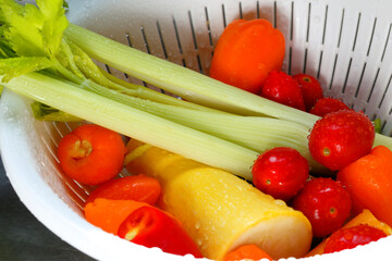Washed Healthy fresh vegetables in  a white colander strainer