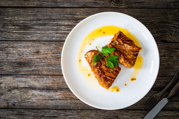 Roasted pork loin on wooden table
