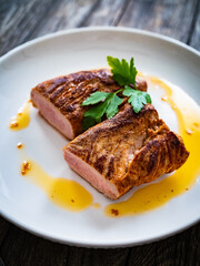 Roasted pork loin on wooden table
