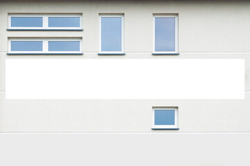 Blank white advertising banner mounted on the facade of the office building