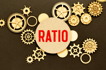 RATIO text on white paper on light background with charts paper