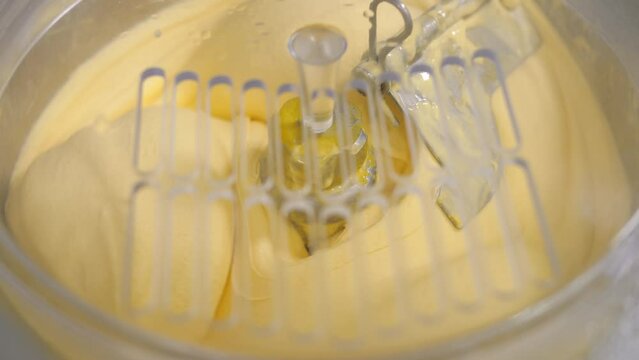 Industrial preparation of italian creamy ice cream. There is machine for making ice cream.The taste of vanilla, banana, mango is mixed.