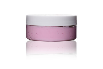pink cream souffle or scrub in transparent plastic jar with white lid on white isolated background...