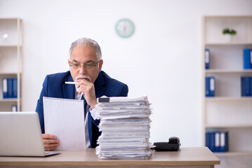 Old male employee and too much work in the office