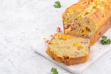 Savory ham and cheese loaf on cutting board
