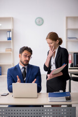 Two colleagues working in the office