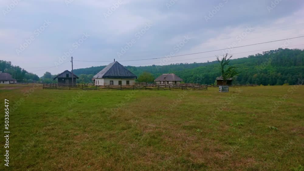 Wall mural The fields of Cossack Village Scansen and the old Hata houses with thatched roofs, Stetsivka village, Ukraine