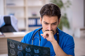 Young male doctor radiologist working in the clinic