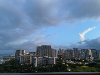 Fototapeta na wymiar Waikiki city view, clouds over the urban area, Oahu island, Hawaii, year 2022 May