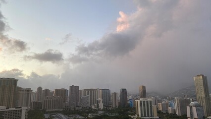Pink sunset clouds over the city of Waikiki, Oahu Island, year 2022 May