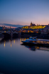 landscape with Vltava river, St. Vitus Cathedral and boat