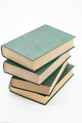 Reading of books. Books stack with green covers on a white background.Knowledge concept.Reading and education. Literature and reading concept. 