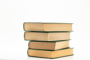  Books stack with green covers on a white background..Reading and education. Literature and reading concept. 