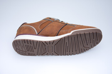 brown sneakers with rubber sole, detail