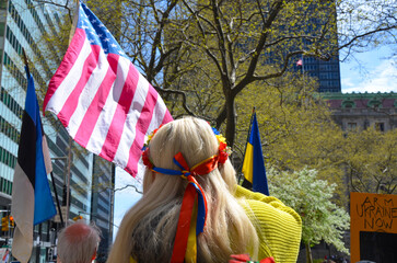 Demonstrators wearing blue and yellow (Ukrainian flag color) to show solidarity for Ukraine at Bowling Green Park in New York City on April 23, 2022.