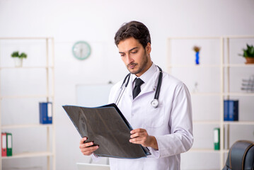 Young male doctor radiologist working in the clinic