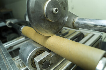 Machine for cutting cardboard bushing for printing house. Cutting cardboard reels and spools for...