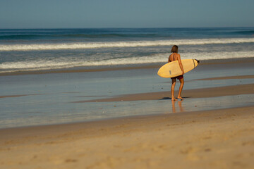 Fototapeta na wymiar Surfer on beach