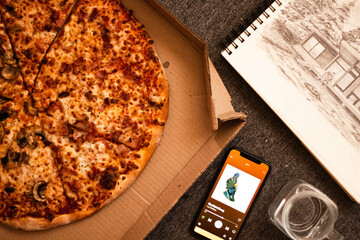 Pizza and phone with music.