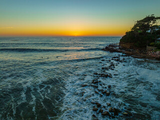 Clear skies aerial sunrise seascape
